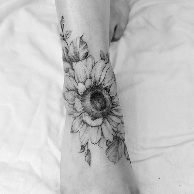 sunflower tattoo on foot